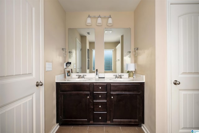 bathroom with tile patterned flooring and vanity