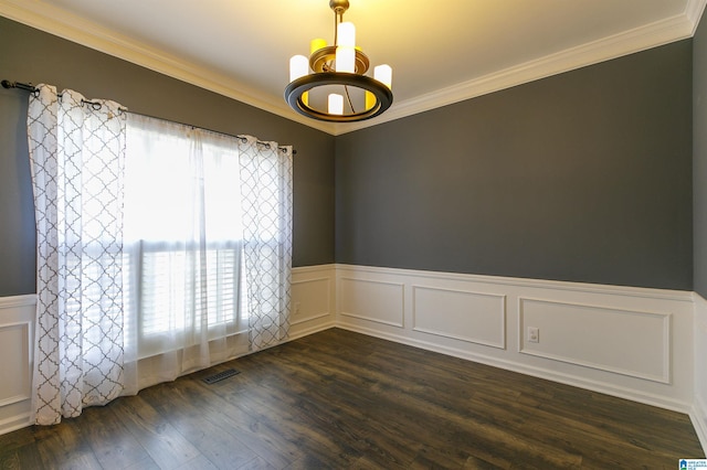 spare room with dark wood-type flooring and ornamental molding