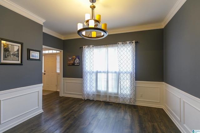 spare room with dark wood-type flooring and ornamental molding