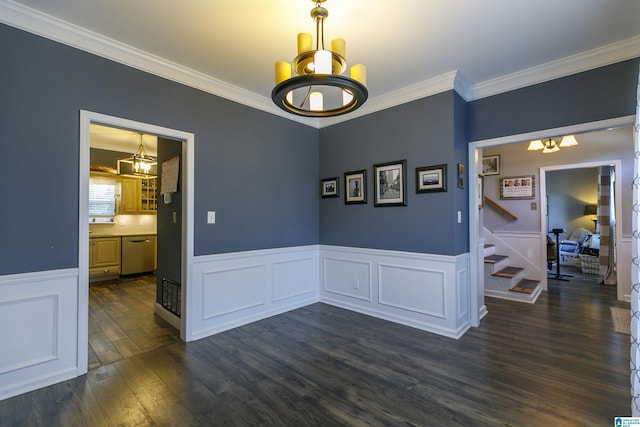 dining space with ornamental molding, dark wood-type flooring, and a notable chandelier