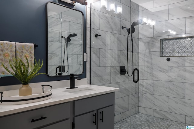 bathroom with vanity and a shower with shower door