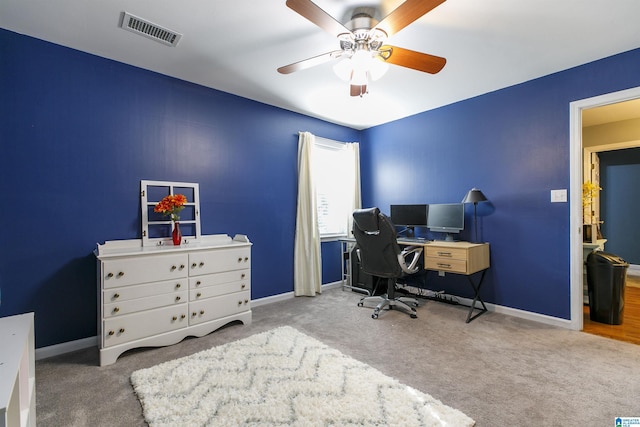 home office with carpet flooring and ceiling fan