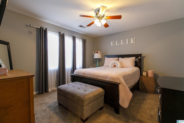 bedroom with dark carpet and ceiling fan