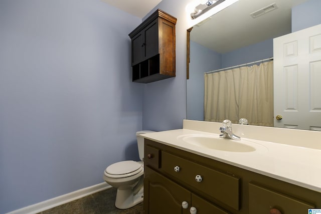 bathroom with vanity, toilet, and a shower with shower curtain