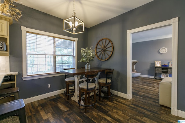 dining space featuring dark wood-type flooring and a chandelier