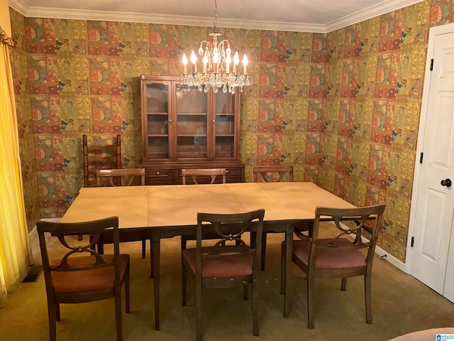 dining area with ornamental molding, an inviting chandelier, and carpet