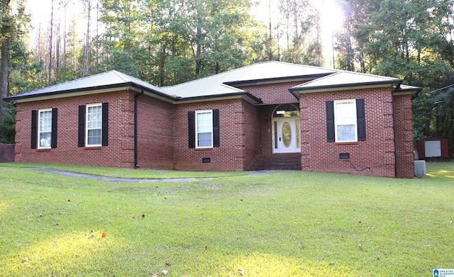 single story home with crawl space, a front lawn, brick siding, and metal roof