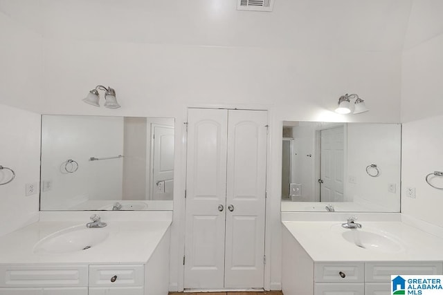 bathroom featuring double vanity