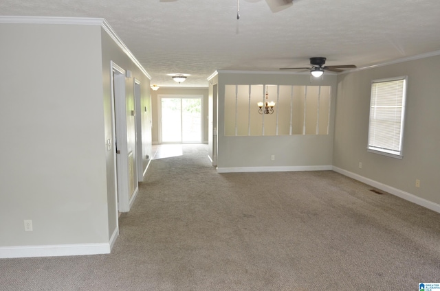 carpeted empty room with crown molding, ceiling fan with notable chandelier, and a textured ceiling