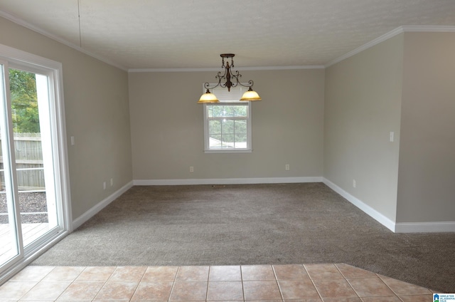 carpeted empty room with crown molding, an inviting chandelier, and a textured ceiling