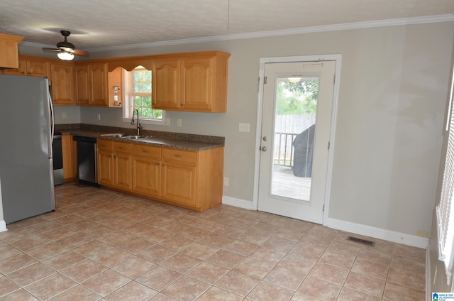 kitchen with stainless steel refrigerator, ornamental molding, black dishwasher, and sink