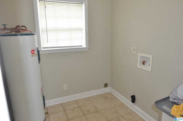 laundry area featuring washer hookup, water heater, and light tile patterned flooring