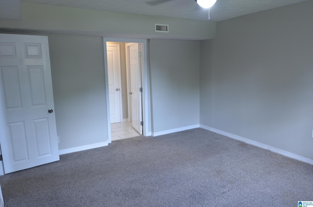 unfurnished bedroom with light colored carpet