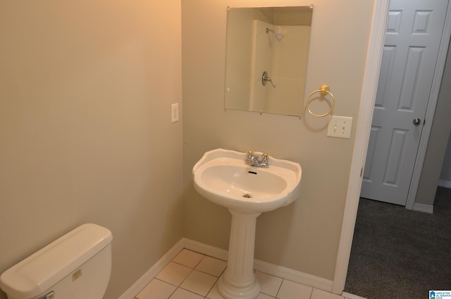 bathroom featuring tile patterned floors and toilet