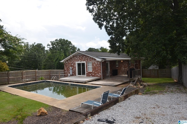 view of swimming pool with a deck