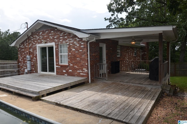 wooden deck featuring ceiling fan