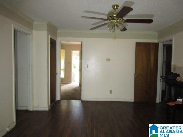 spare room featuring crown molding, ceiling fan, and hardwood / wood-style floors