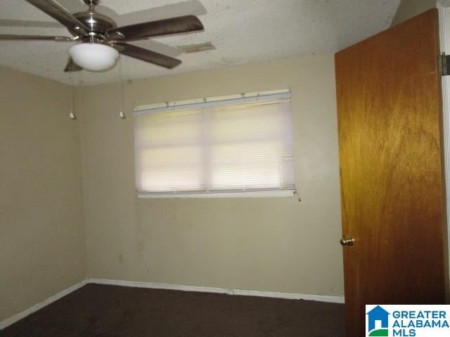 unfurnished room featuring ceiling fan