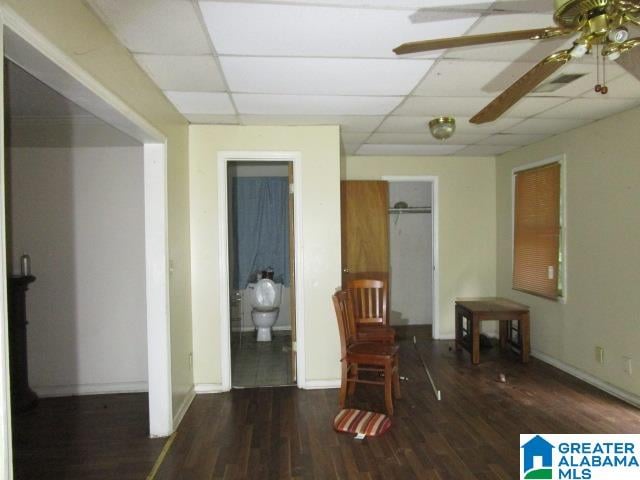 misc room featuring ceiling fan, hardwood / wood-style flooring, and a paneled ceiling