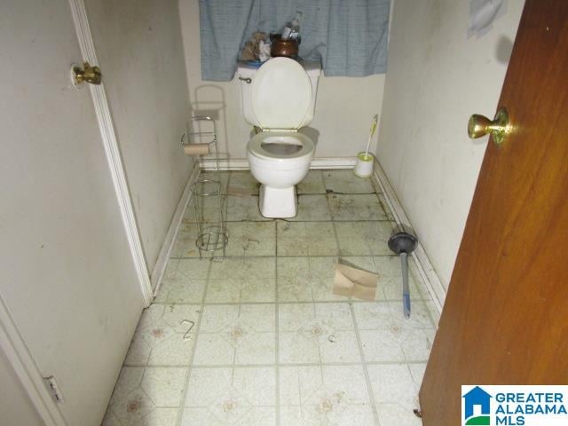 bathroom featuring tile patterned flooring and toilet