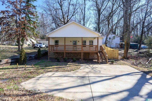 view of front of property with covered porch and a front yard