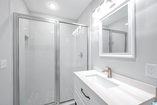 bathroom with vanity and an enclosed shower