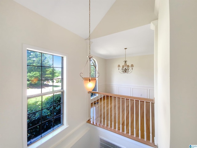 corridor featuring a chandelier