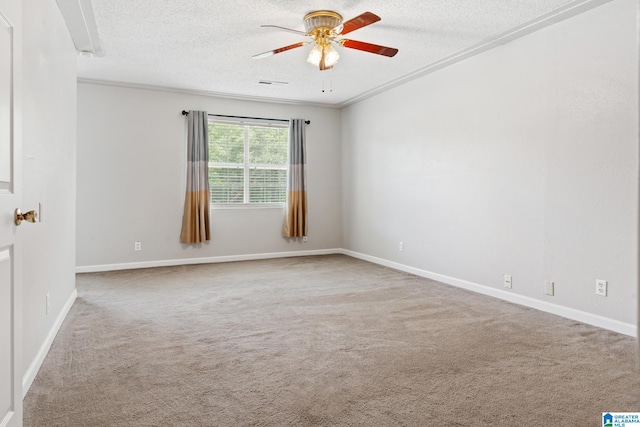 spare room with carpet, a textured ceiling, and ceiling fan