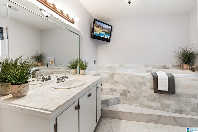 bathroom with vanity and a textured ceiling