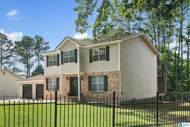 view of front of home with a front lawn and a garage