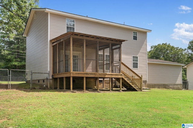 back of house featuring a lawn