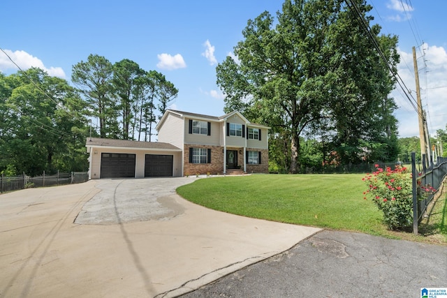 view of front of house with a garage and a front yard