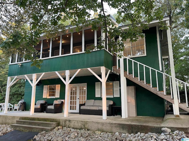 view of front of property with an outdoor hangout area, french doors, and a patio area