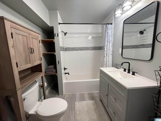 full bathroom featuring hardwood / wood-style flooring, toilet, shower / bathtub combination with curtain, and vanity