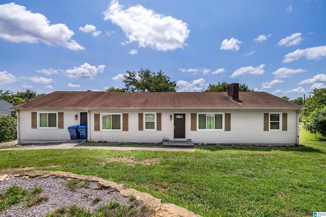 single story home featuring a front lawn