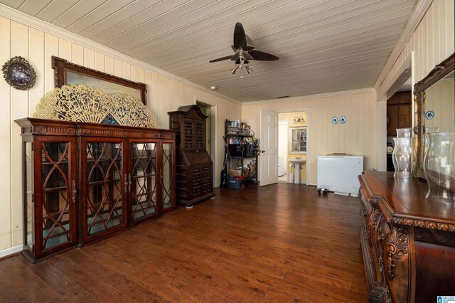 interior space featuring crown molding, dark wood-type flooring, sink, and ceiling fan