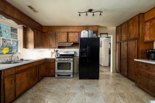 kitchen with sink and black appliances