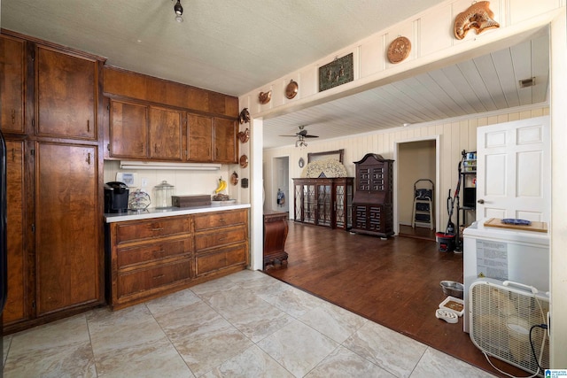 kitchen featuring ceiling fan and light wood-type flooring