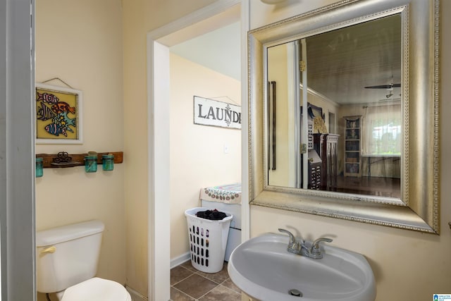 bathroom with tile patterned floors, sink, and toilet