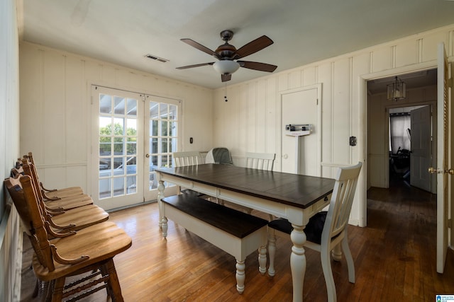 dining room featuring ceiling fan, french doors, and hardwood / wood-style floors