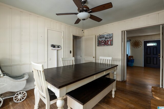 dining space with ornamental molding, dark hardwood / wood-style floors, and ceiling fan