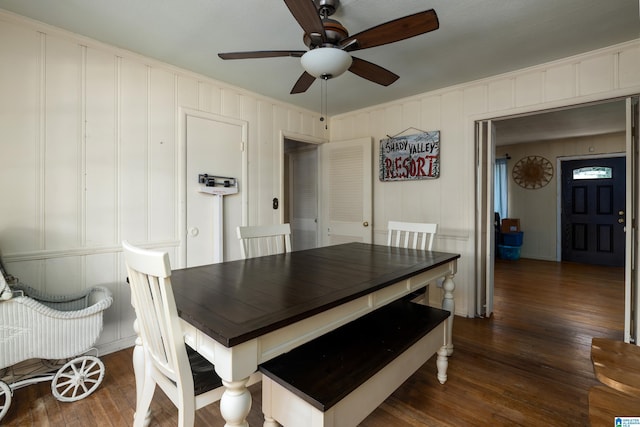 dining room featuring ceiling fan, crown molding, and dark hardwood / wood-style floors