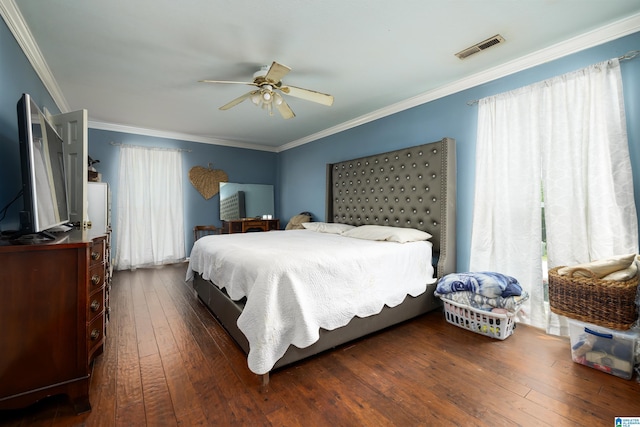 bedroom featuring ceiling fan, dark wood-type flooring, and ornamental molding