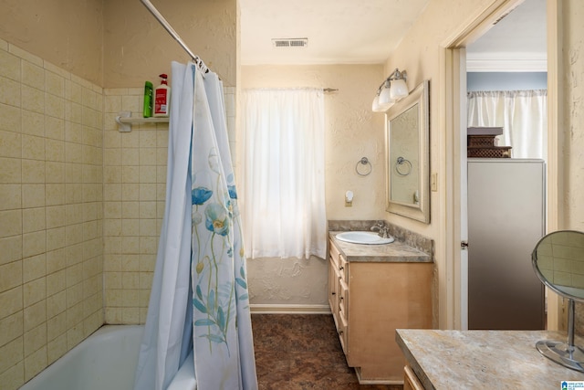 bathroom featuring shower / bathtub combination with curtain and vanity