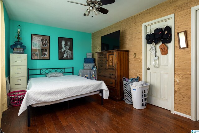 bedroom featuring hardwood / wood-style floors and ceiling fan