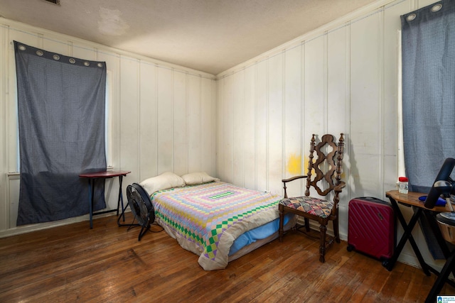 bedroom featuring dark hardwood / wood-style flooring