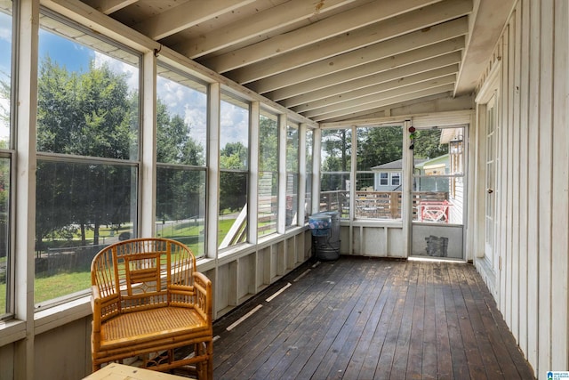 sunroom featuring lofted ceiling