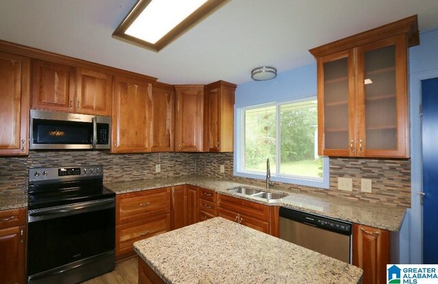 spare room featuring ceiling fan and light hardwood / wood-style floors