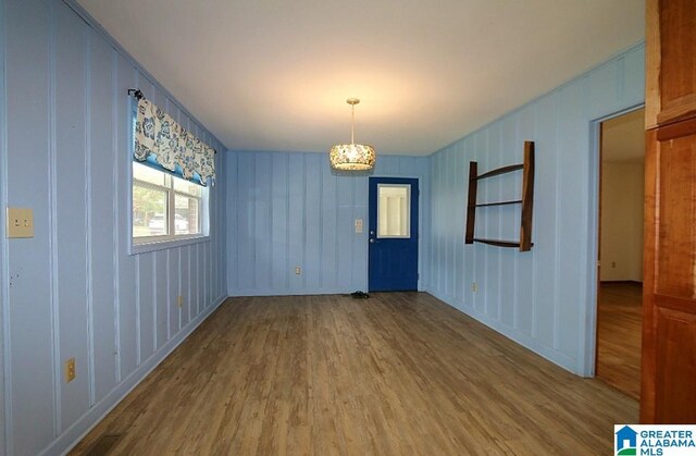 unfurnished room featuring hardwood / wood-style floors