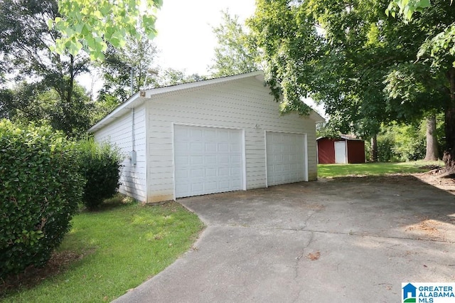 garage featuring a lawn